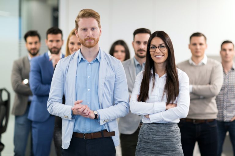 portrait-of-business-team-posing-in-office